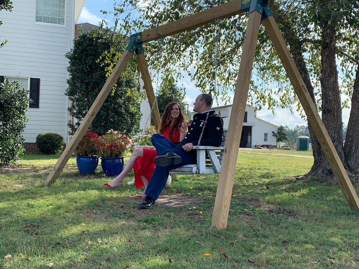Couple on the porch swing at Parkton Place