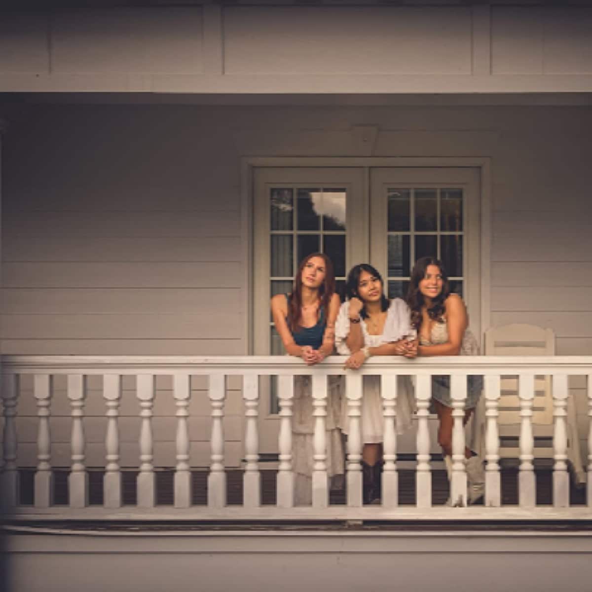 Friends gathered on the upstairs balcony at Parkton Place