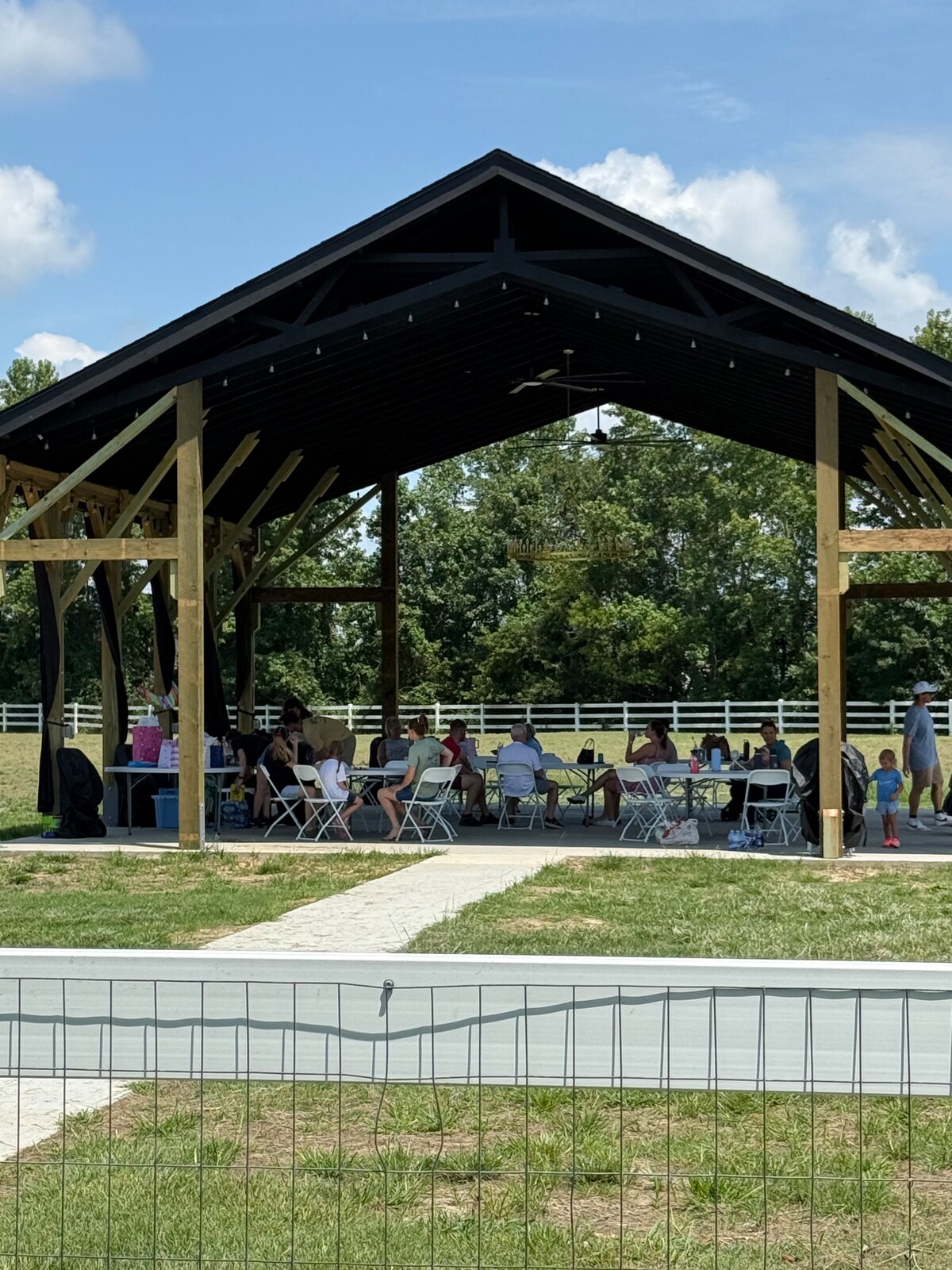 Family gathering under the pavilion at Parkton Place